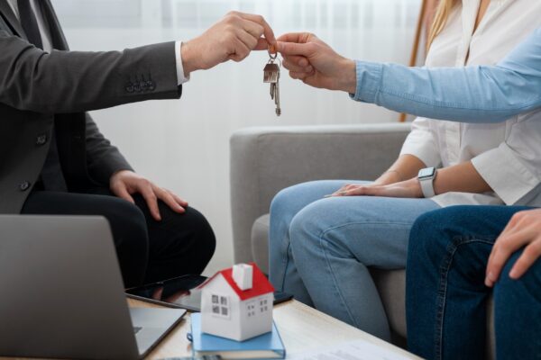 Real estate agent at work showing house and doing business