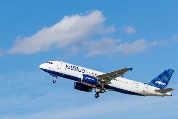 white and blue Jetblue airliner flying on sky
