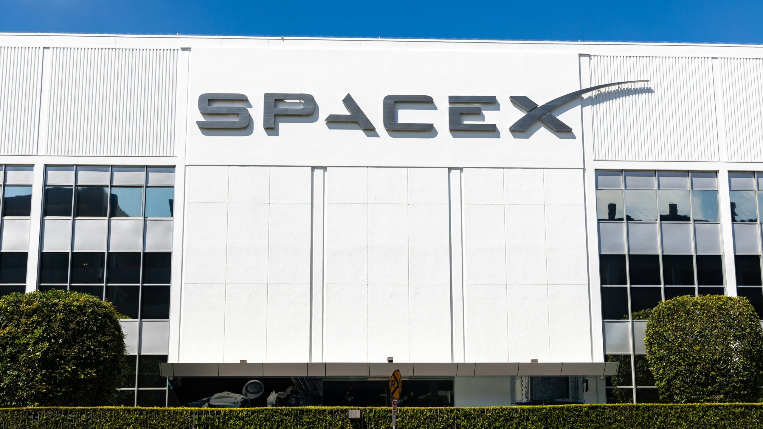 a building with a sign that says spacex on it