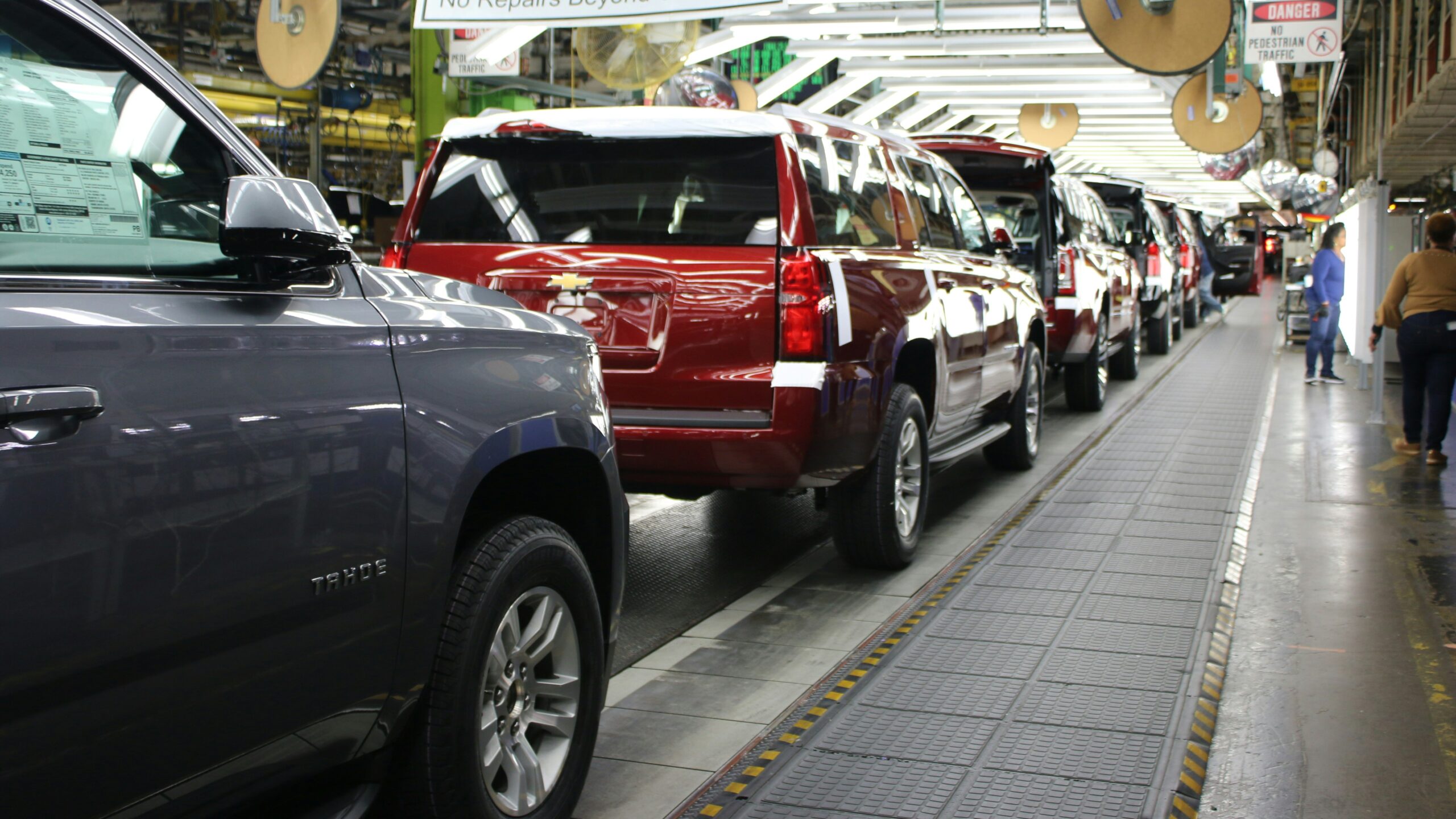 a row of cars parked in a parking lot