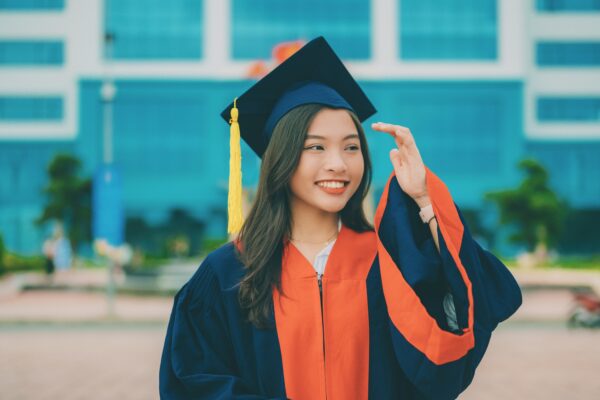 a woman in a graduation cap and gown