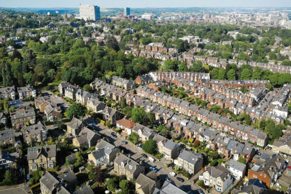 an aerial view of a city with lots of houses
