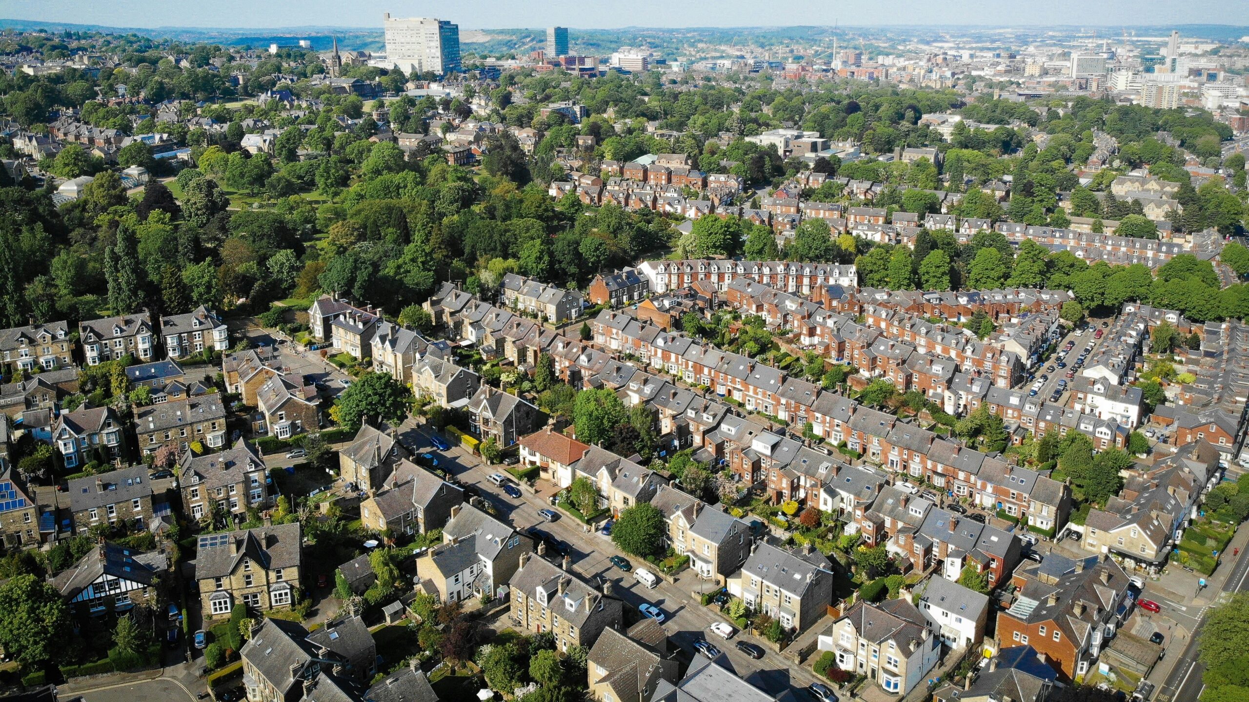 an aerial view of a city with lots of houses
