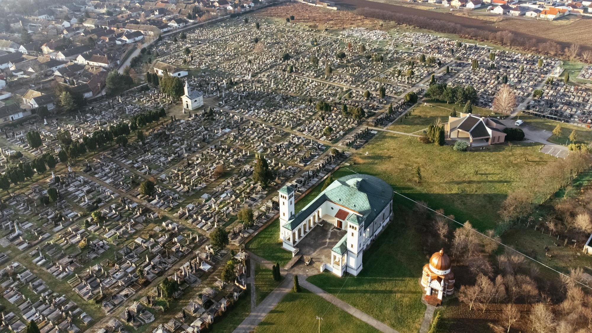 Drone view of the Catholic church and cemetery on the sunrise Sombor Serbia Europe