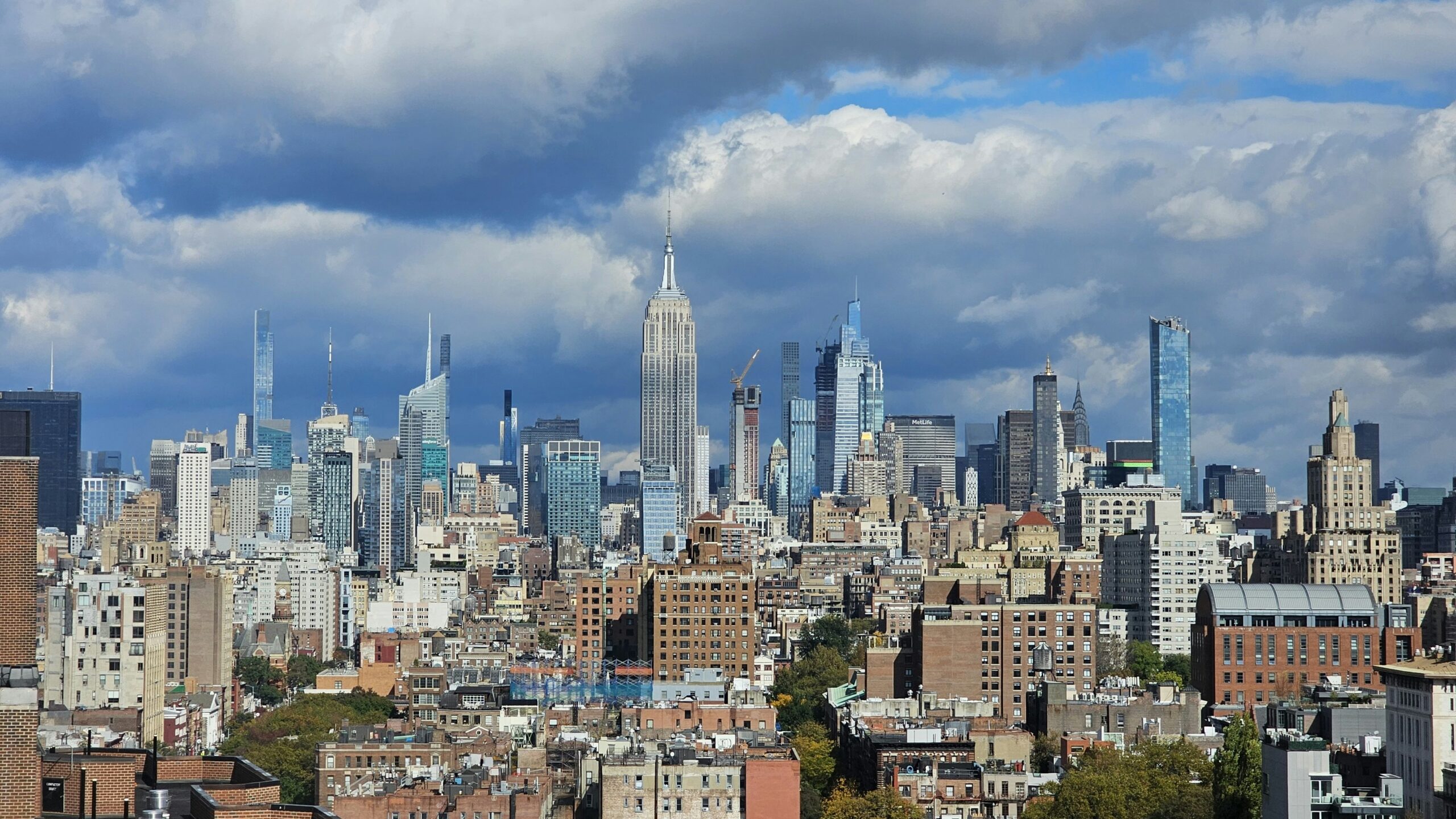 a view of a large city with tall buildings