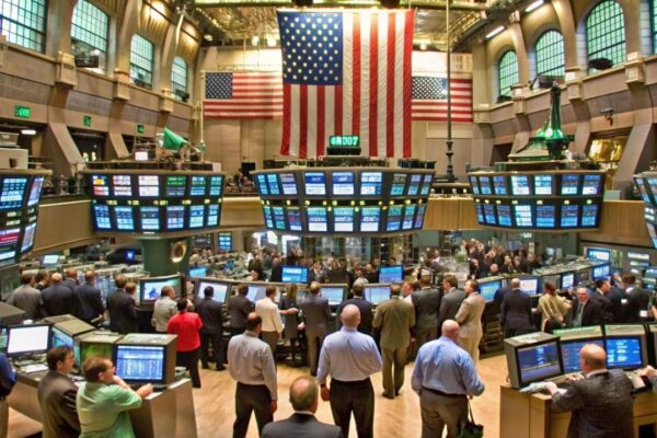 This is the interior of the New York Stock Exchange on Wall Street It shows traders looking at the monitors on the walls tracking the Dow Jones