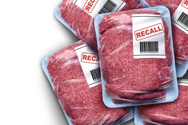 Ground Meat Recall concept as a symbol of contaminated beef or Bacterial outbreak with salmonella or listeria foodborne illness causing food poisoning dangerous bacteria as a public health risk