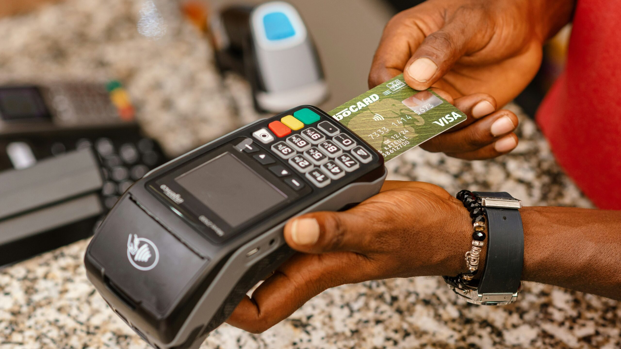 a person holding a credit card in their hand
