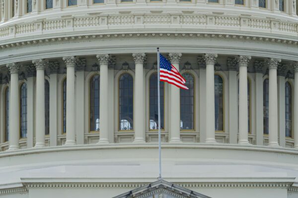 us a flag on white concrete building
