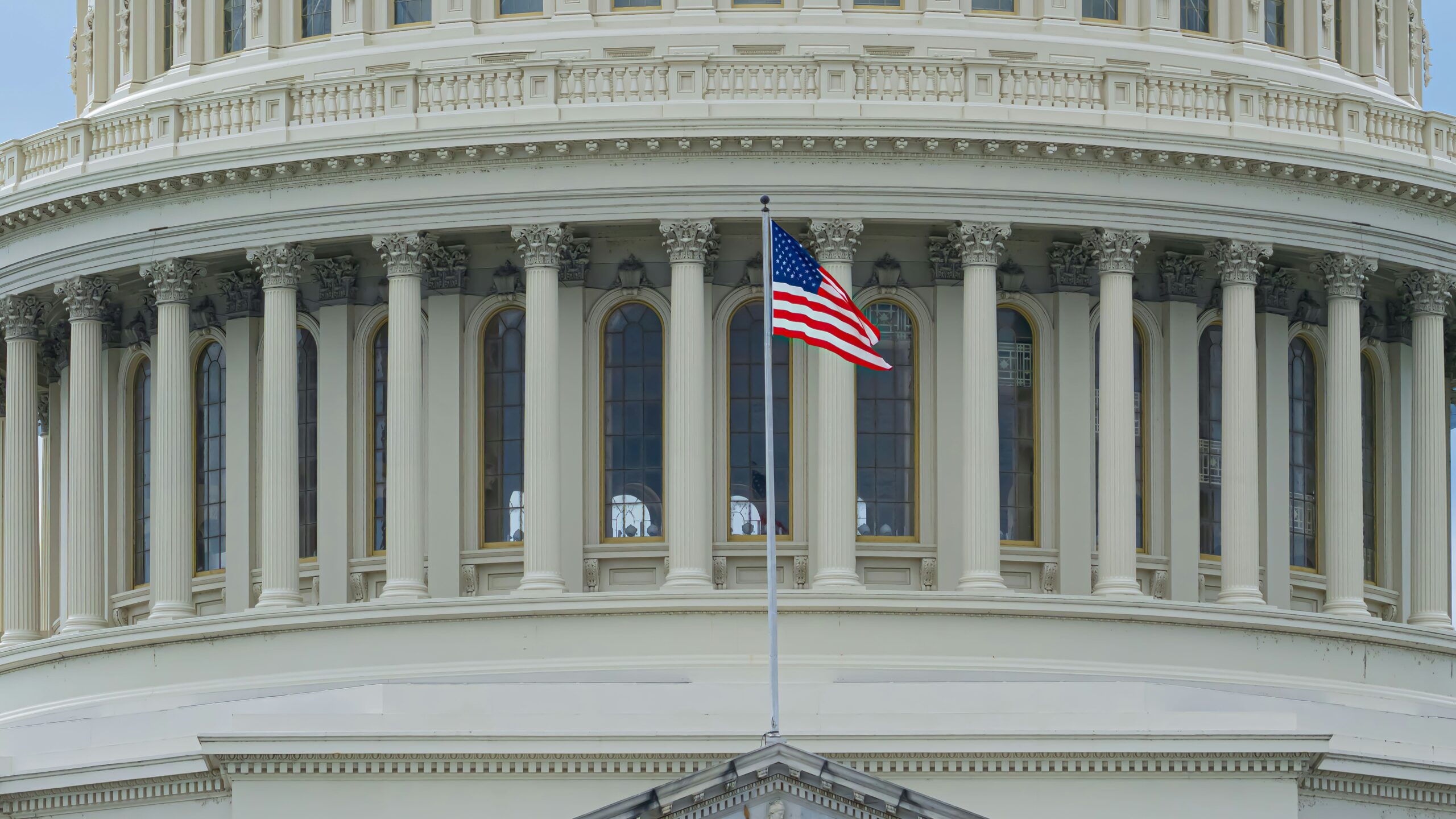 us a flag on white concrete building