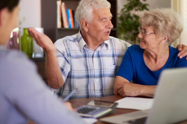 Senior couple making a financial deal
