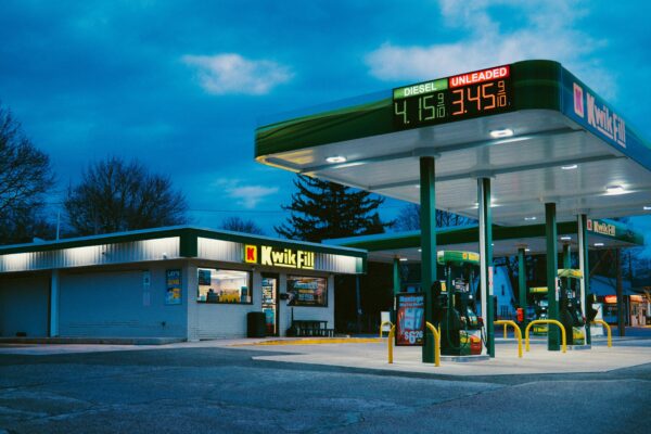 A gas station sits under the night sky.