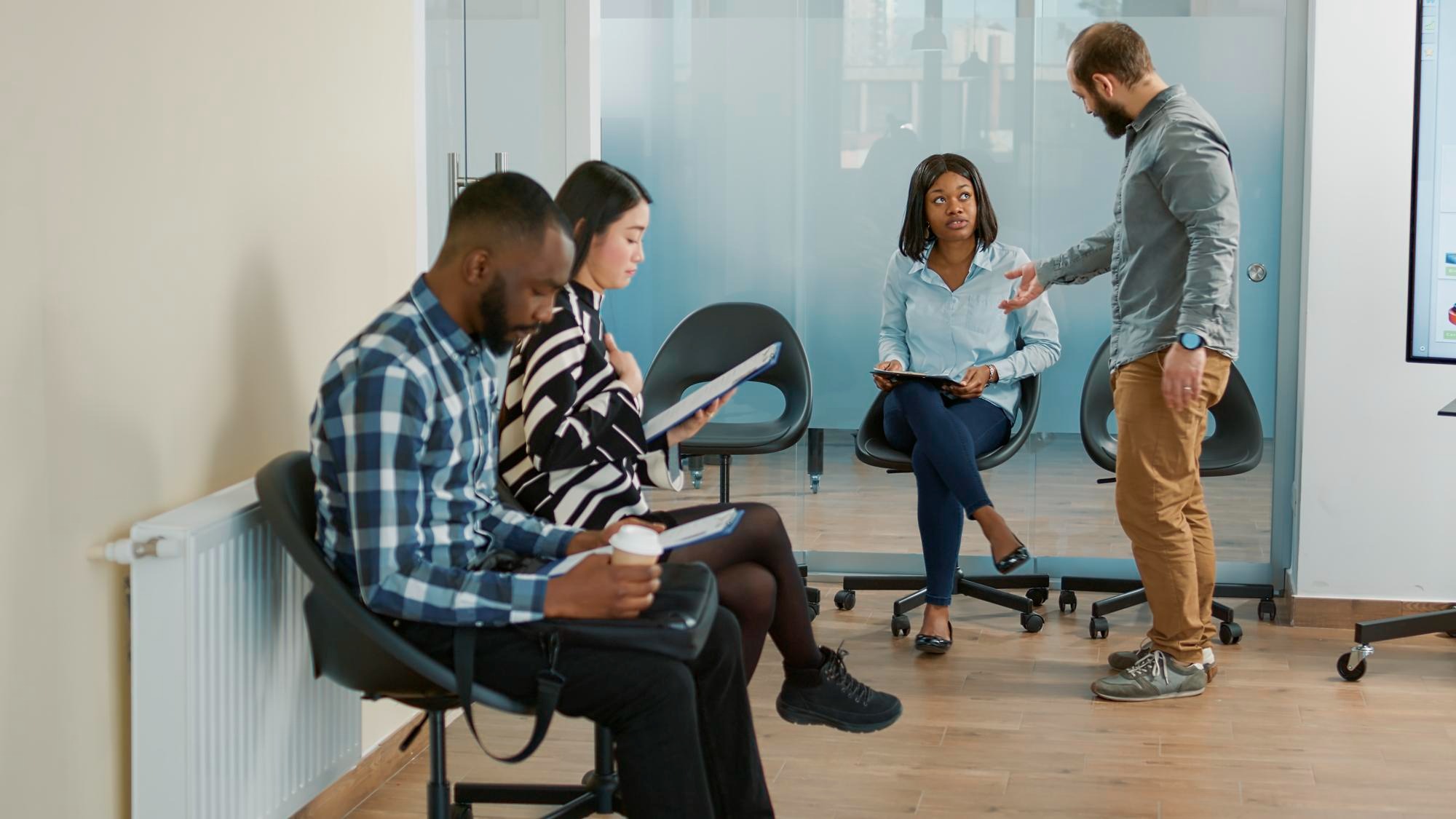 Company employee calling for applicant to attend job interview in office with HR recruiter. Man and job candidate with cv and career opportunity starting hiring meeting, recruitment offer.