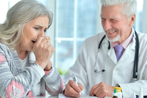 Senior doctor with elderly patient