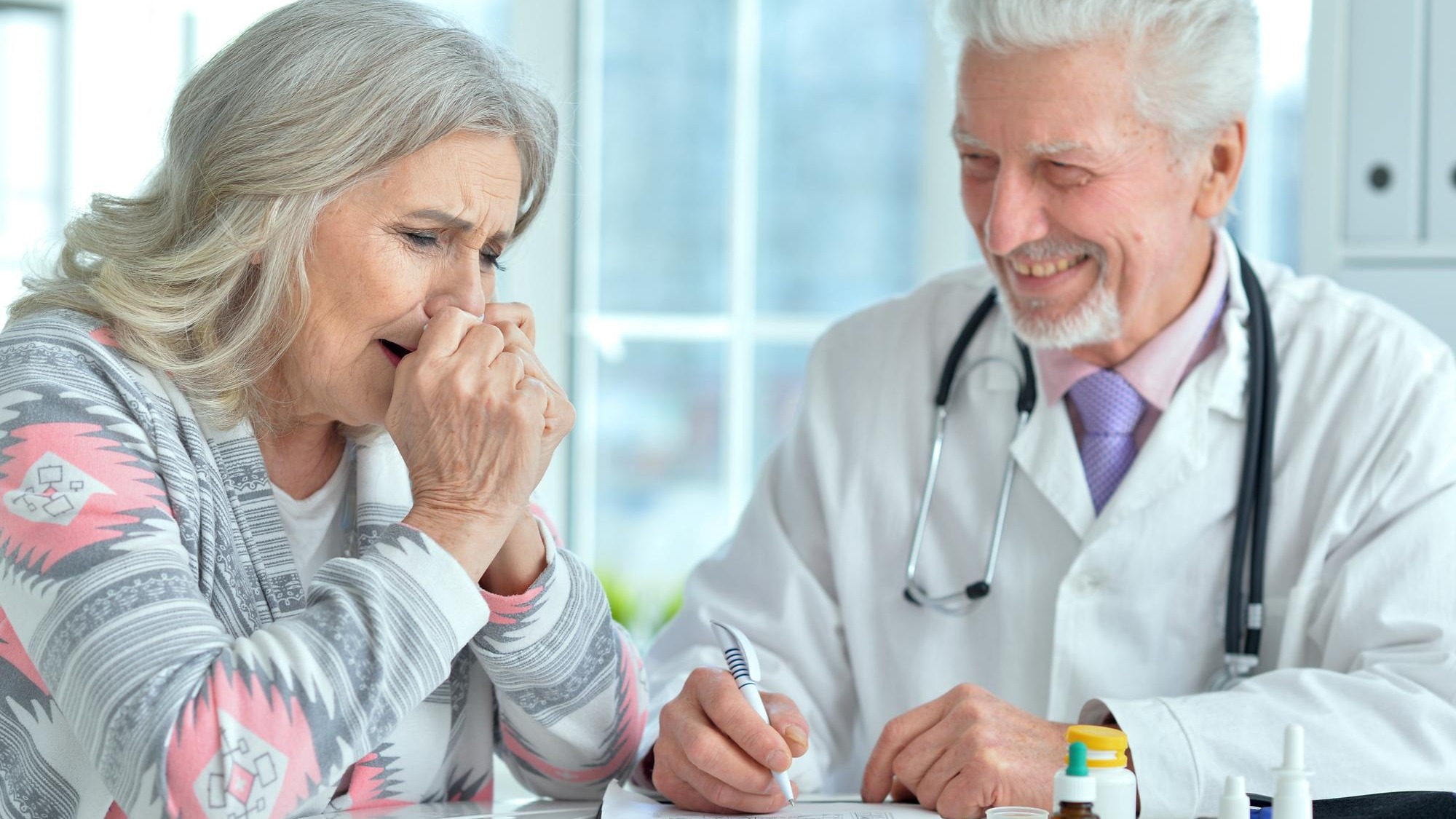Senior doctor with elderly patient