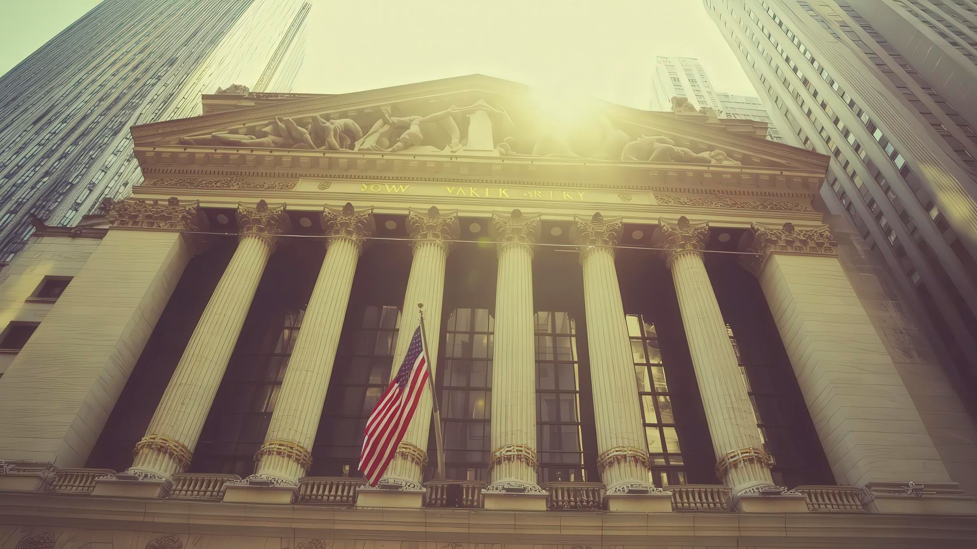 Historic facade of financial building with pillars and american flag in sunlight