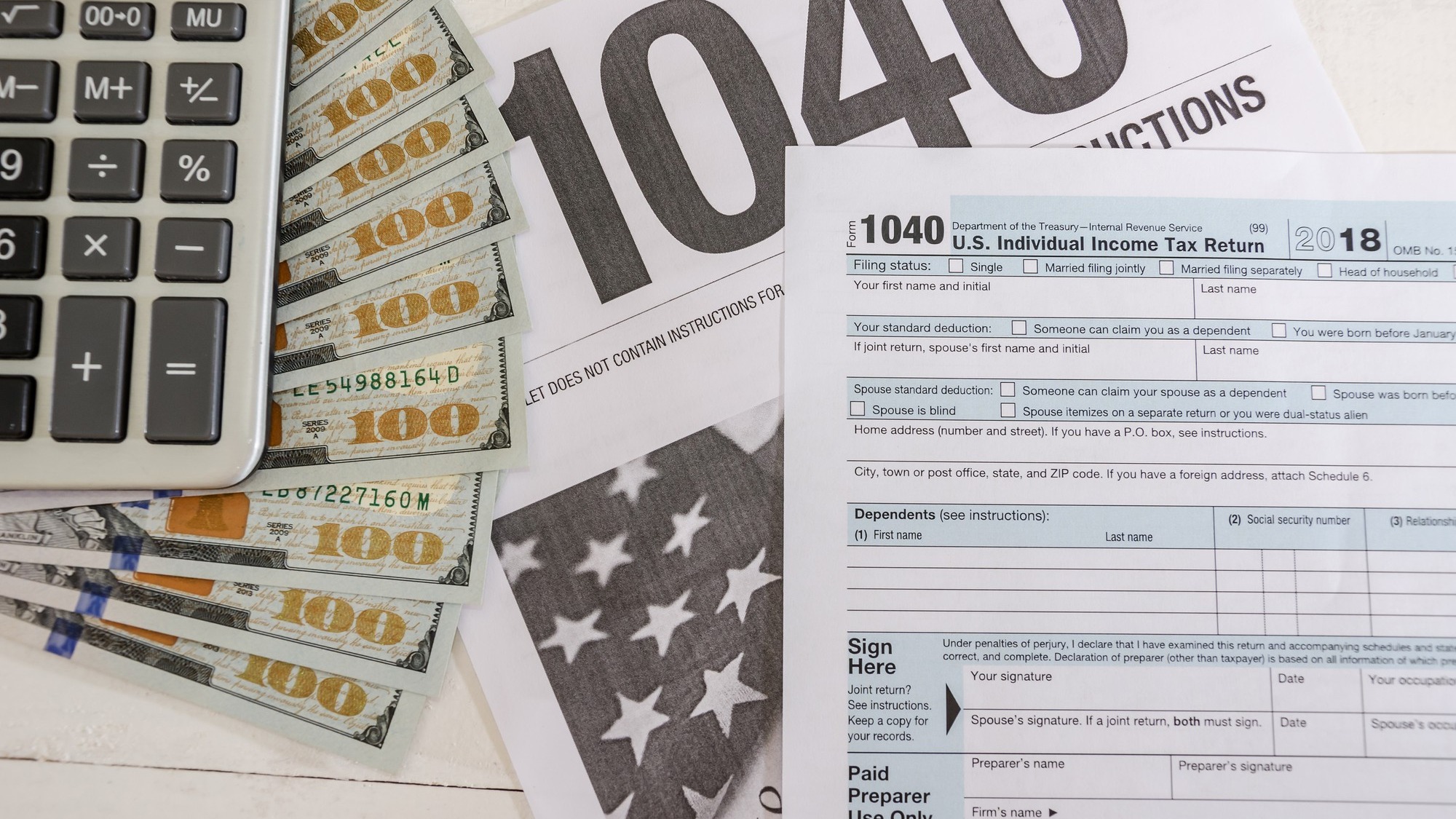 tax forms 1040 and dollars