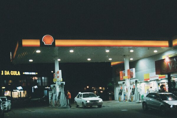 Gas station at night with cars refueling