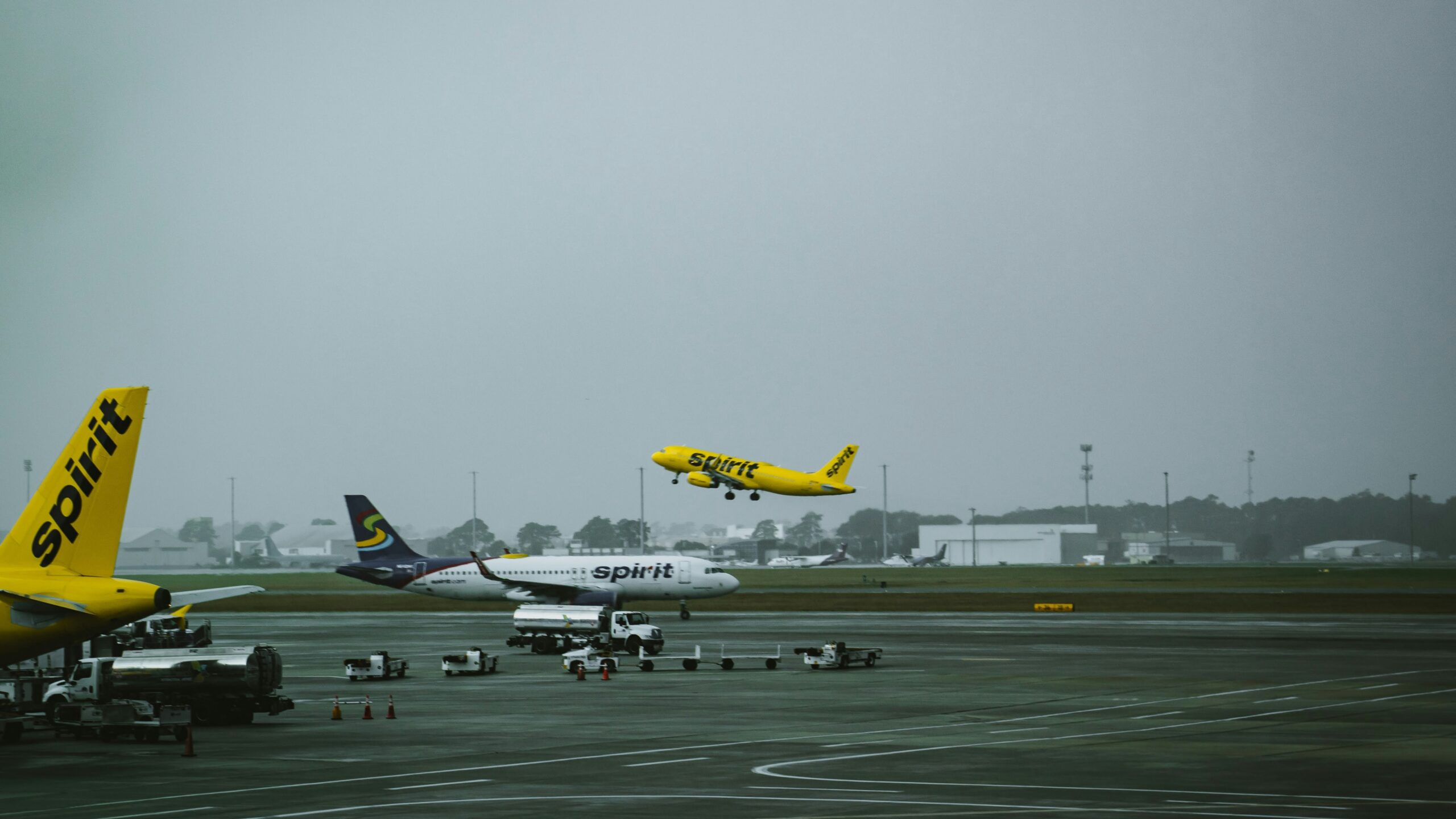 a group of airplanes at an airport