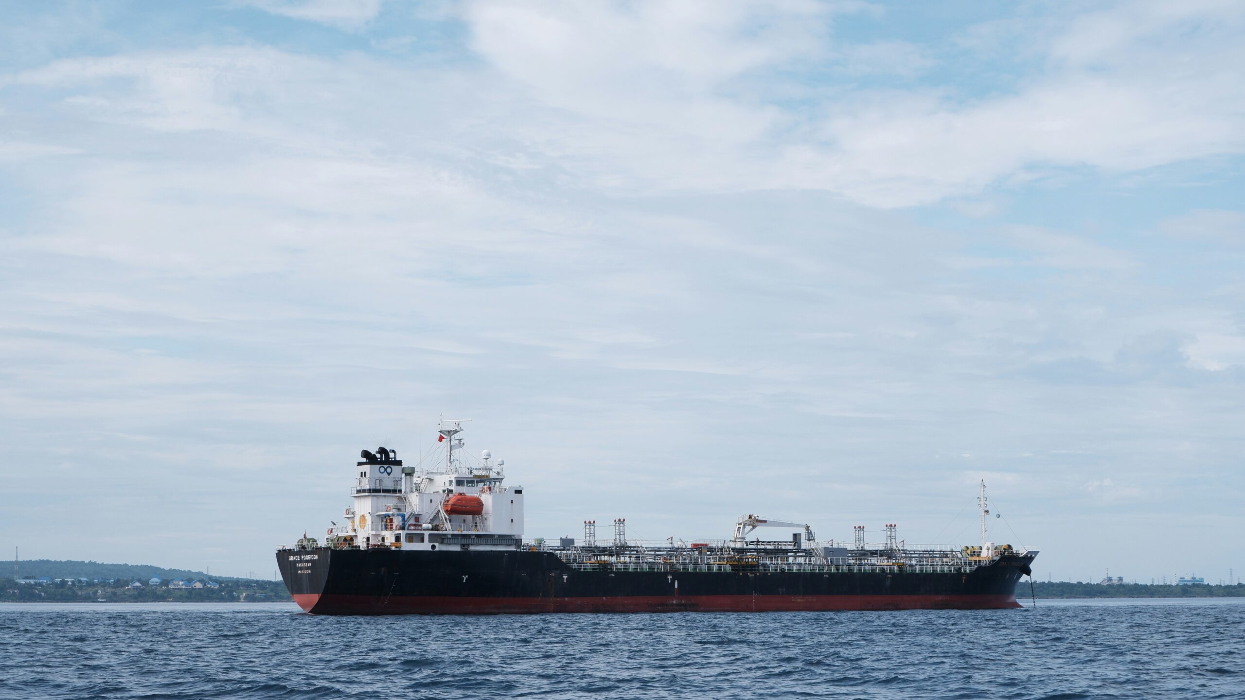 a large boat floating on top of a body of water