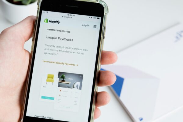 person holding space gray iphone 6