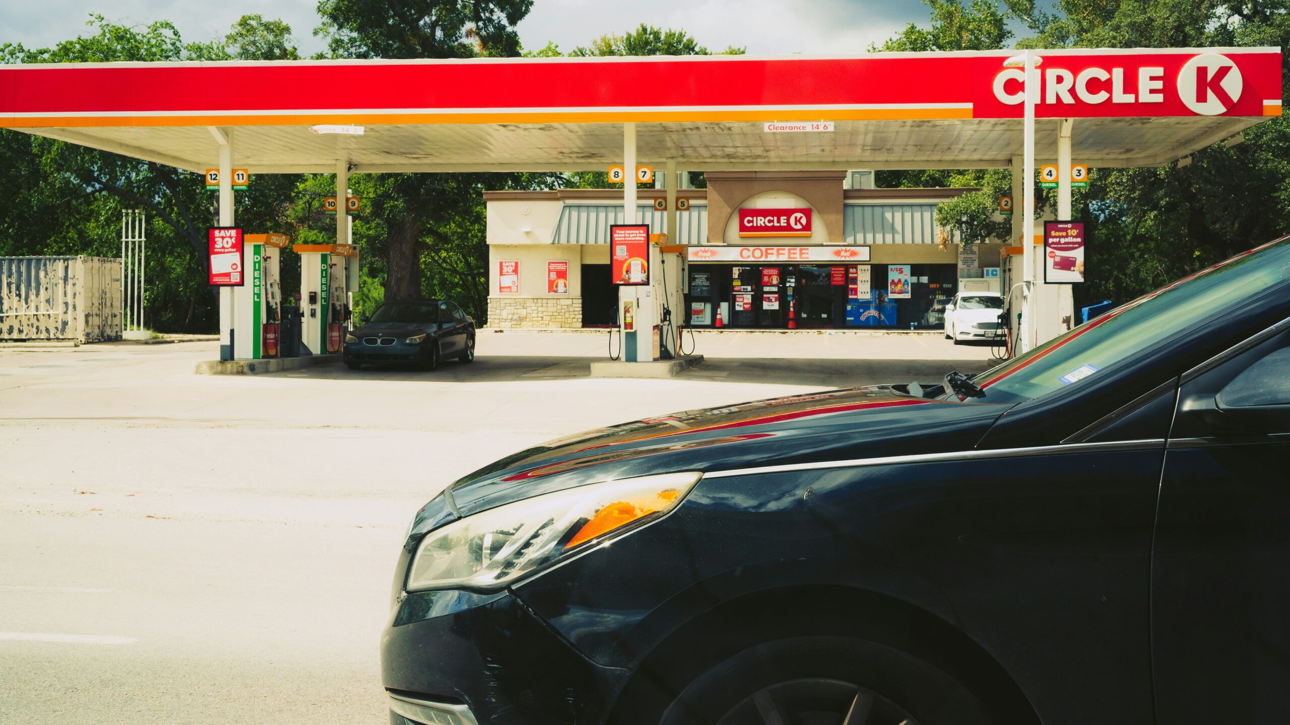 Circle k gas station with cars and trees