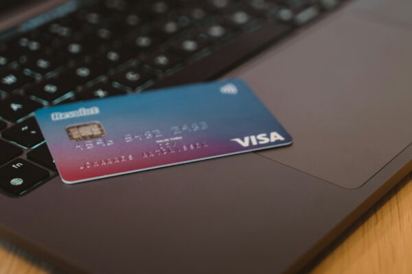 blue and white visa card on silver laptop computer