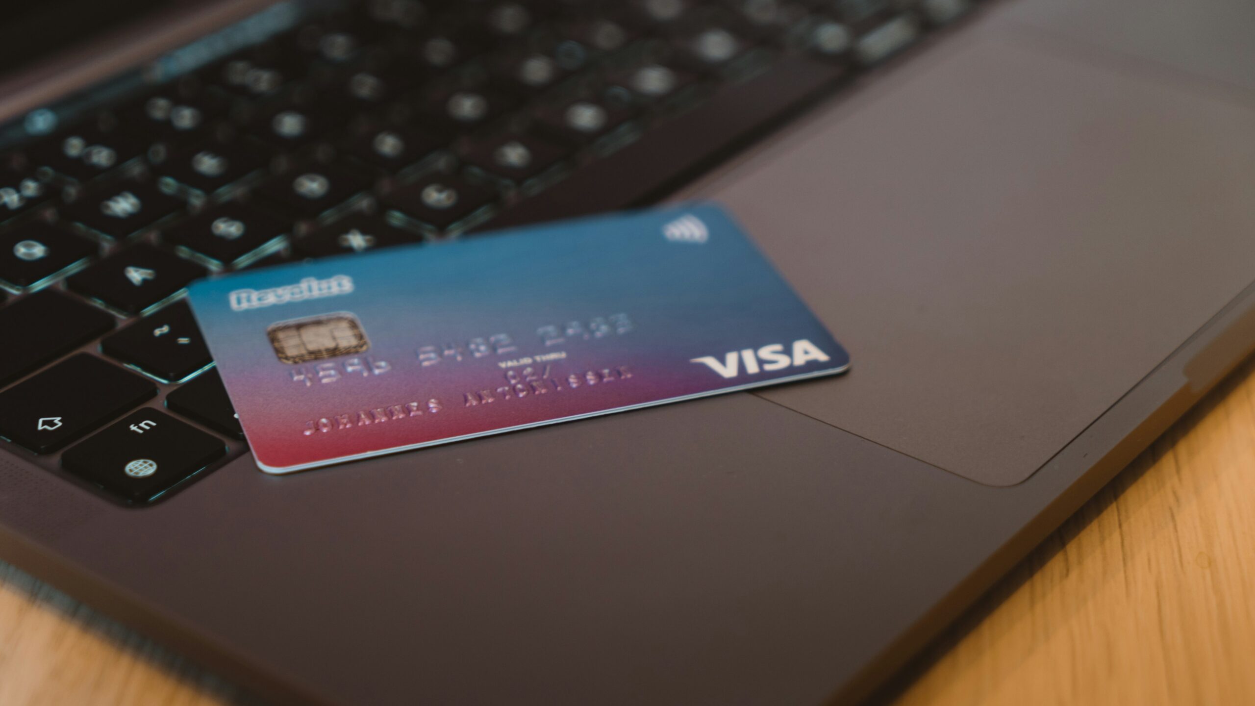 blue and white visa card on silver laptop computer
