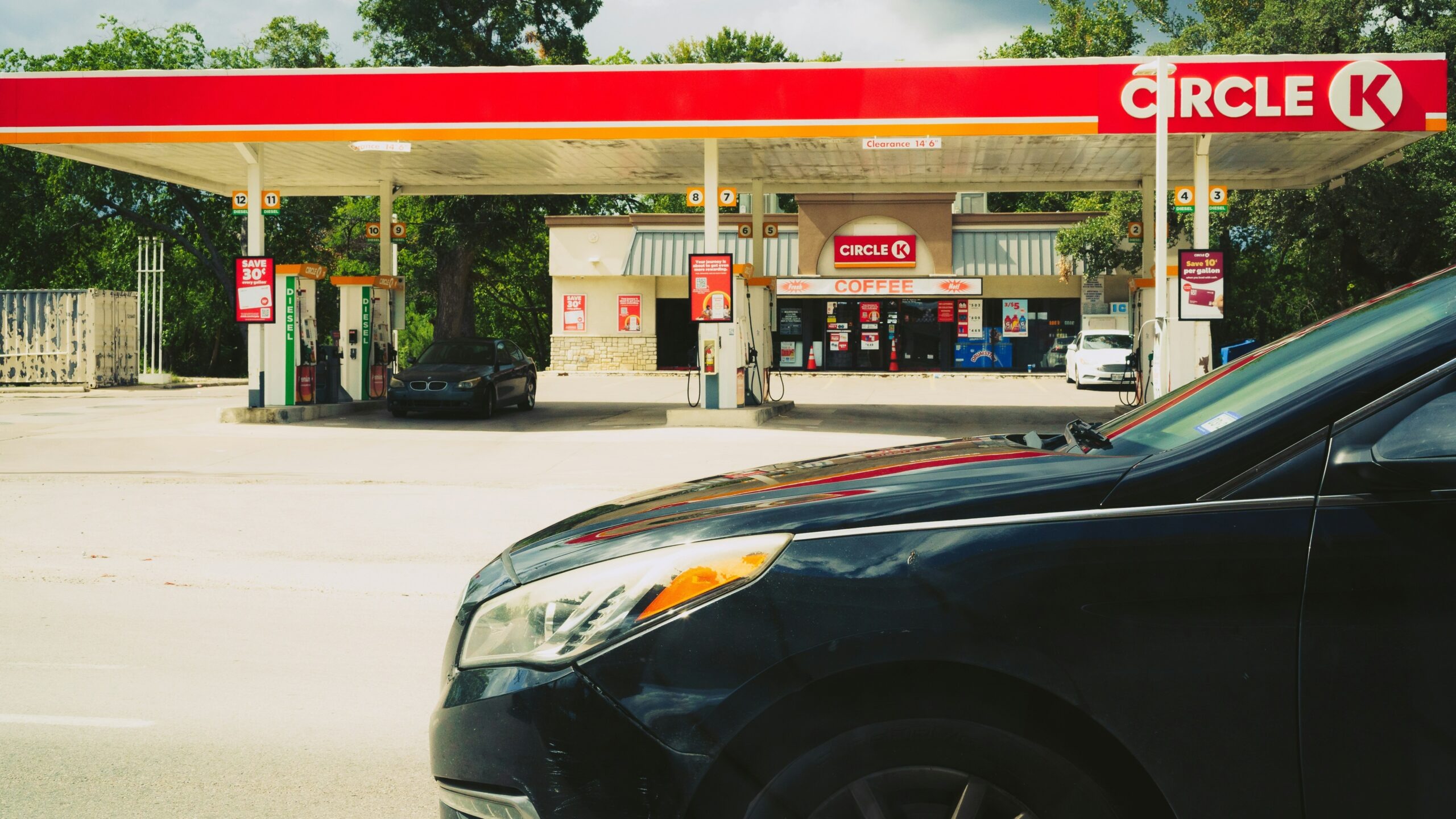 Circle k gas station with cars and trees