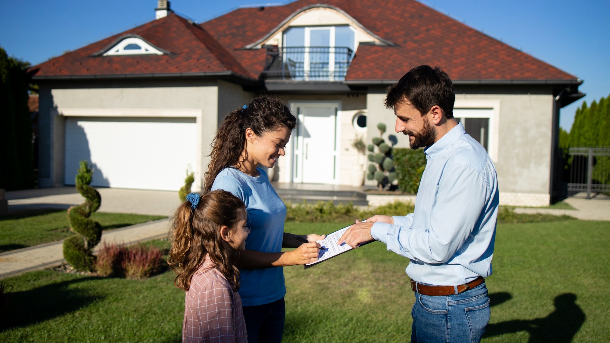 Woman signing the contract and buying new house.
