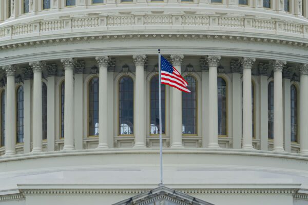 us a flag on white concrete building