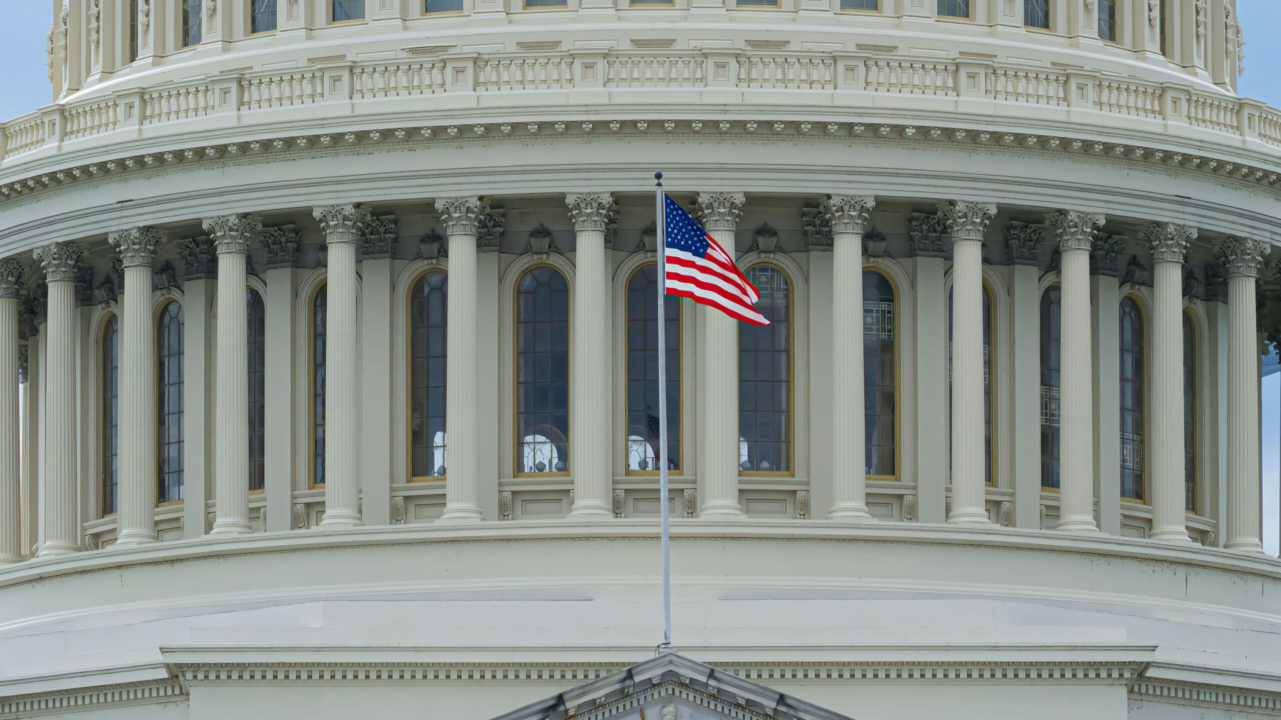 us a flag on white concrete building