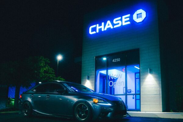 A car parks in front of a chase bank.
