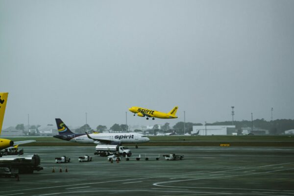 a group of airplanes at an airport
