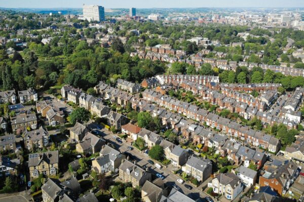an aerial view of a city with lots of houses