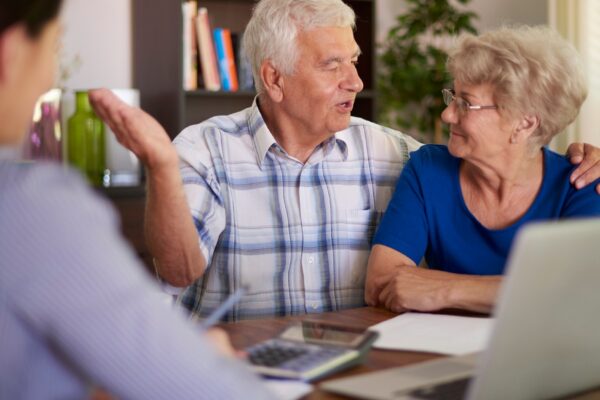 Senior couple making a financial deal