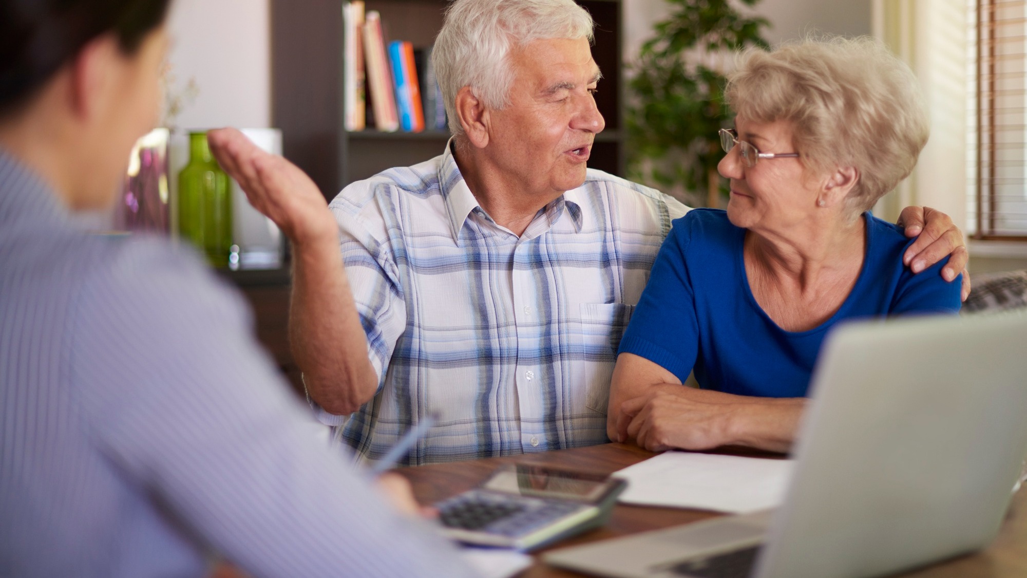 Senior couple making a financial deal