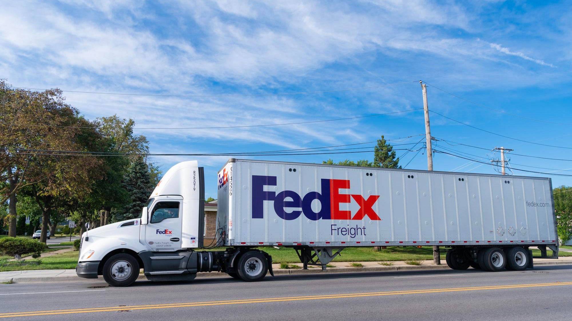 Chicago USA August 21 2024 Truck with FedEx container on truck on the road FedEx Corporation a