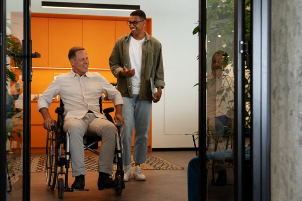 Man in a wheelchair having an inclusive office job