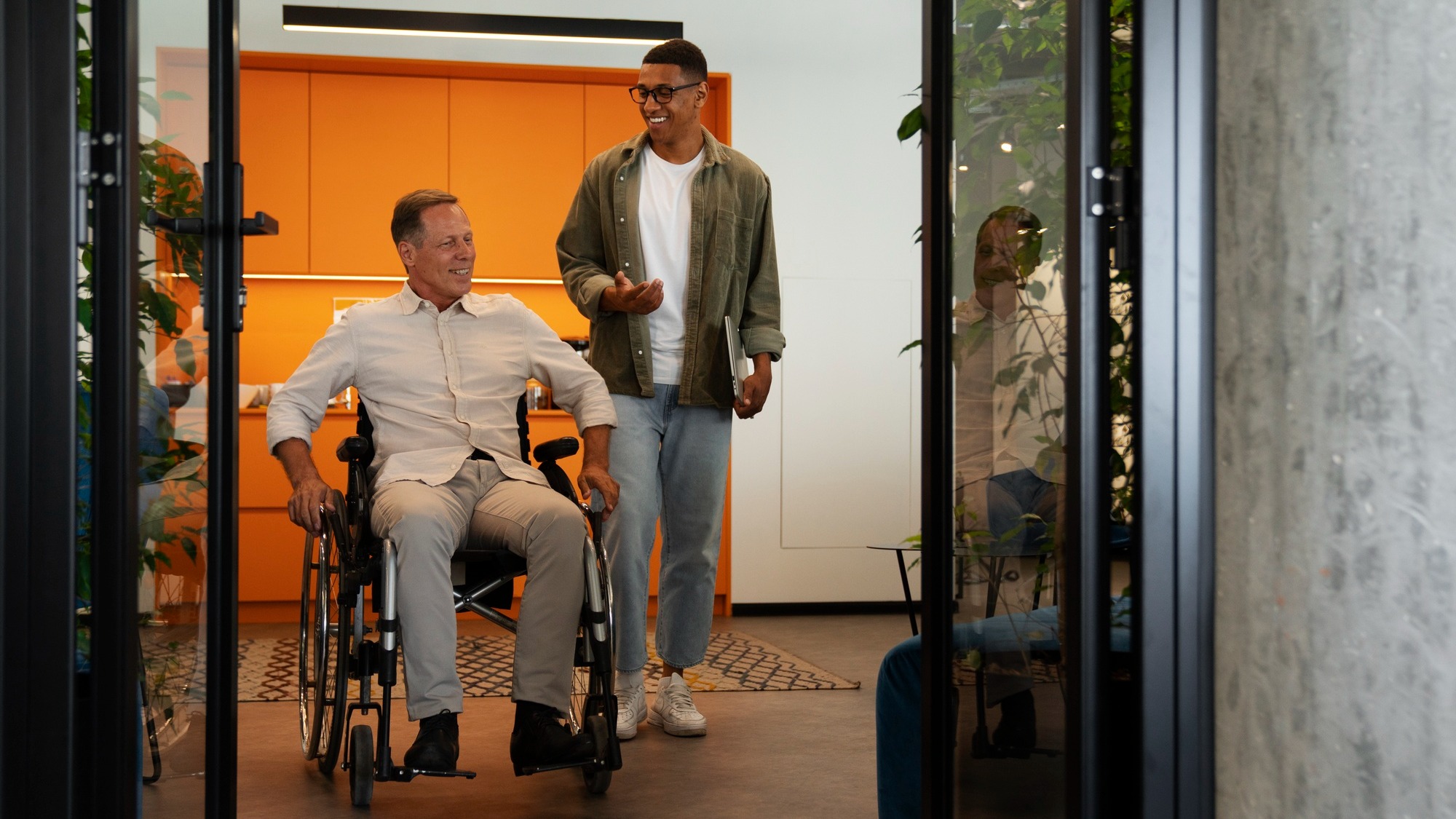 Man in a wheelchair having an inclusive office job