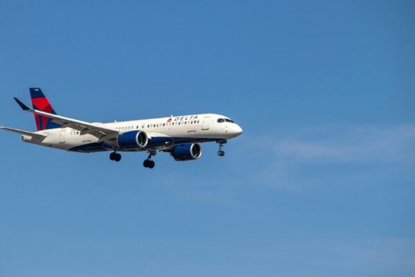 a large airplane flies through the air