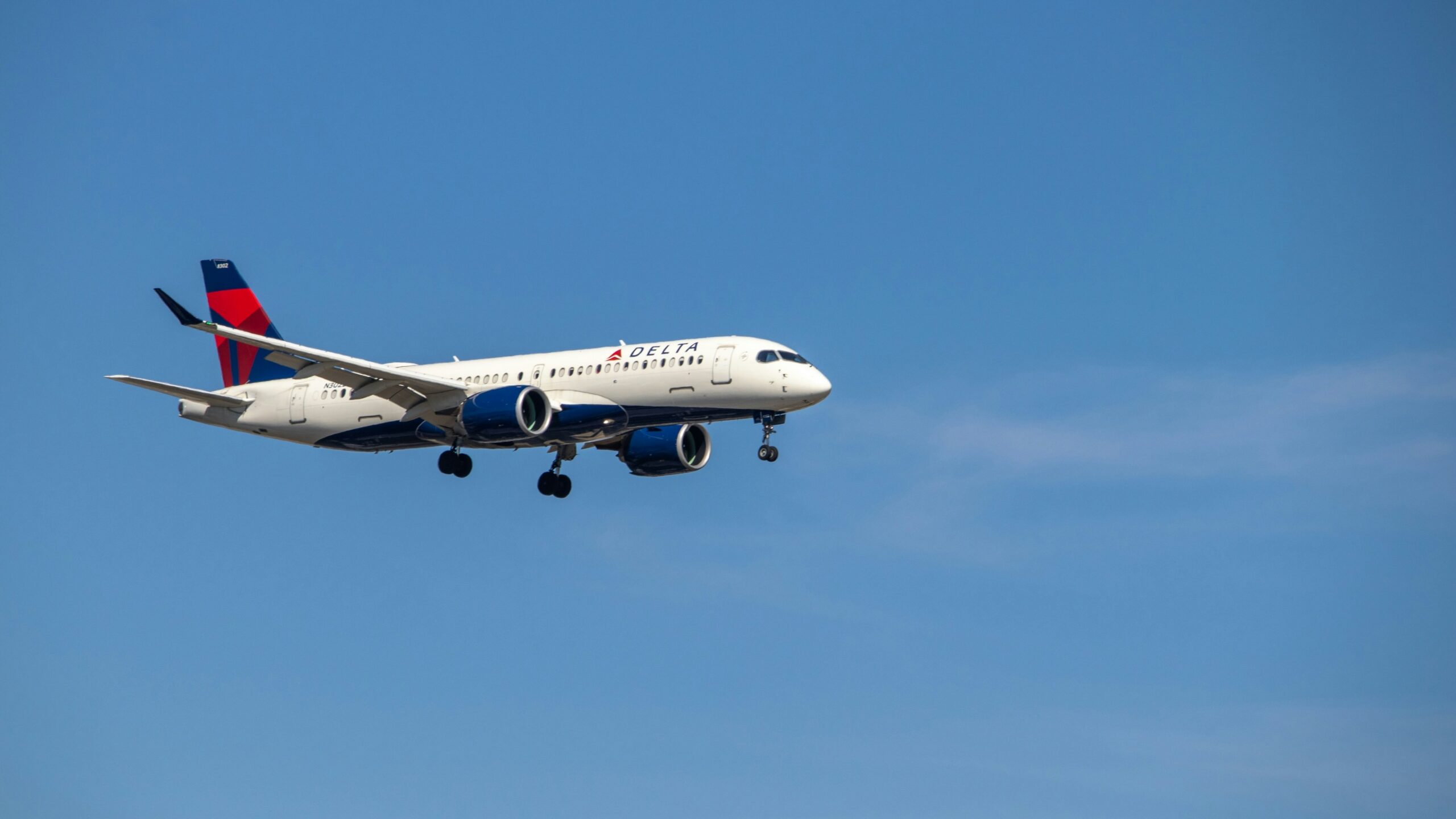 a large airplane flies through the air