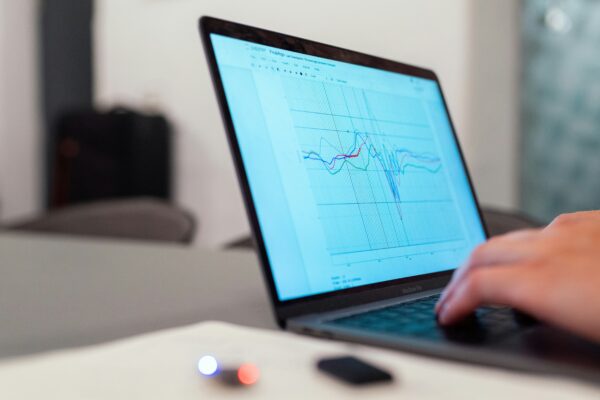 person using black laptop computer