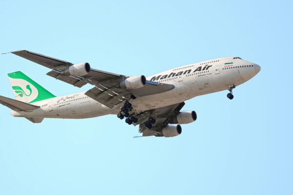 a large airplane flies through the air