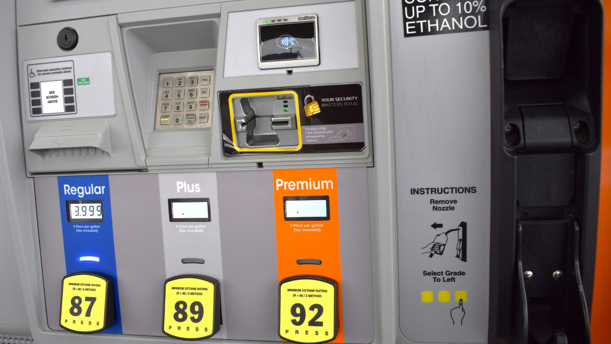 a close up of a gas pump with gas prices