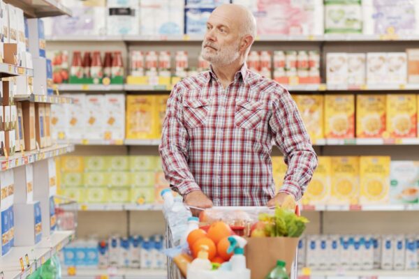Mature man buying groceries at the supermarket