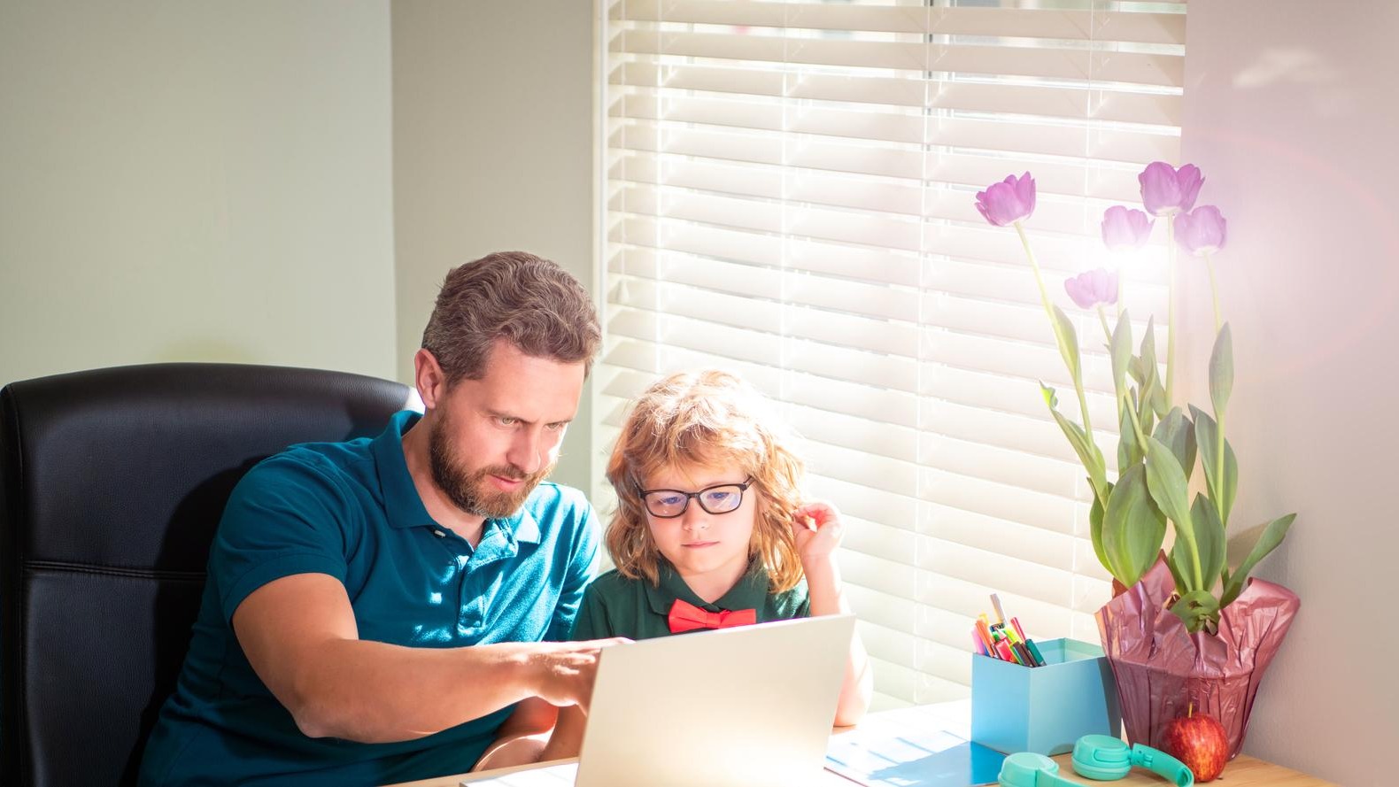 Banner of teacher and pupil school boy with laptop at home happy daddy helping his school son kid