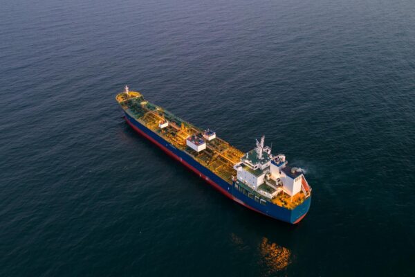 Aerial view oil ship tanker carrier oil on the sea at sunset
