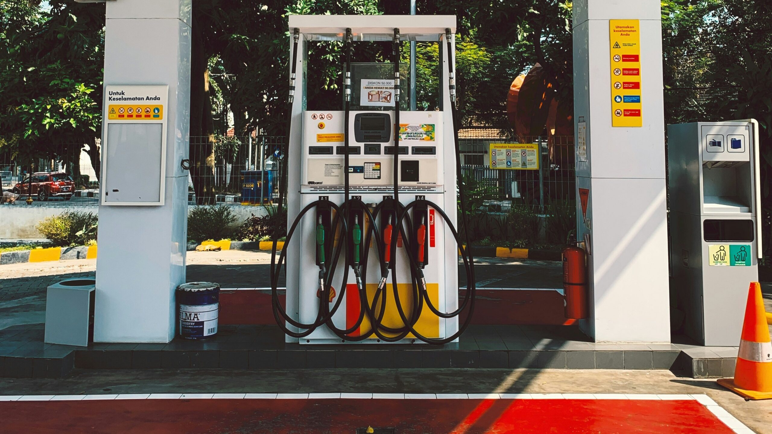 a gas station with a red carpet on the floor