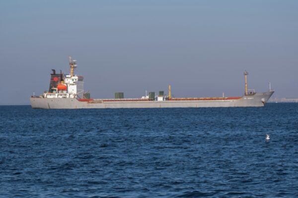A large cargo ship in the middle of the ocean